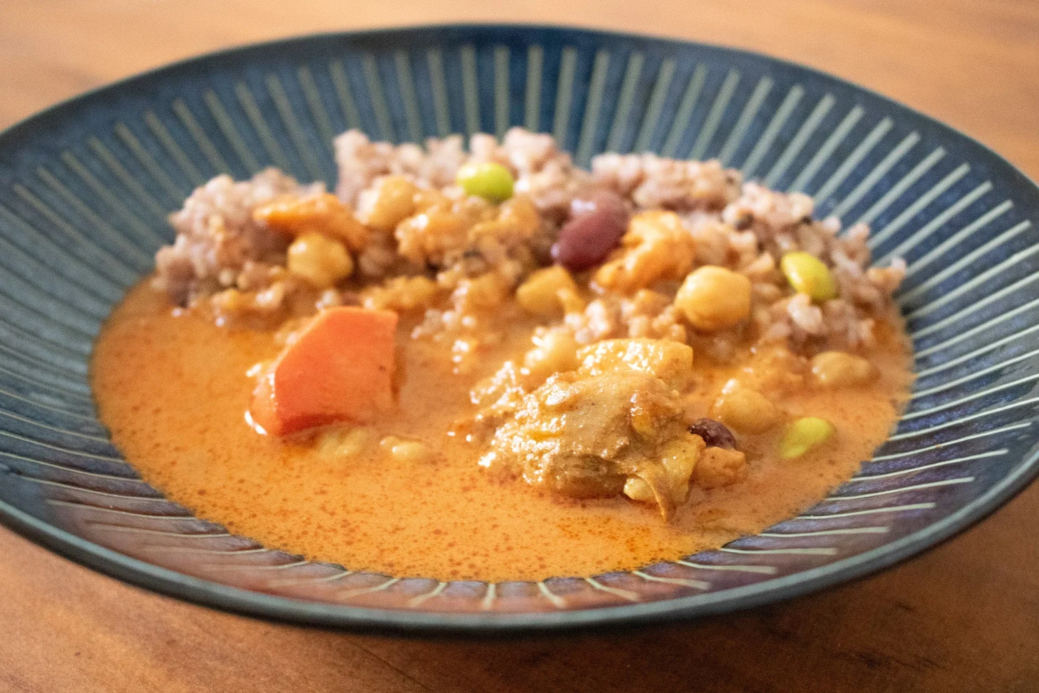 Detailed view of colorful vegetables and chickpeas in the curry