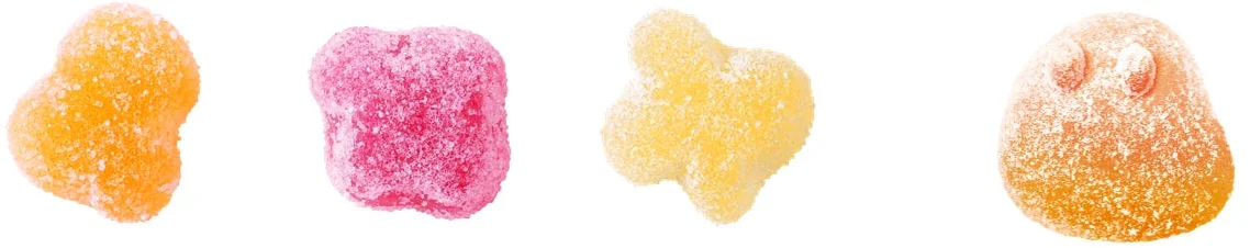 Three flavors of small soda gummies: Orange, Grape, and White Soda