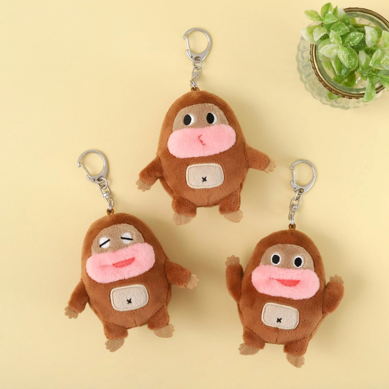 Three different facial expressions of the mascot charms