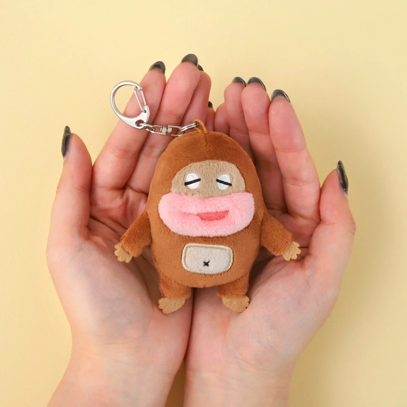 Mascot charm attached to a bag