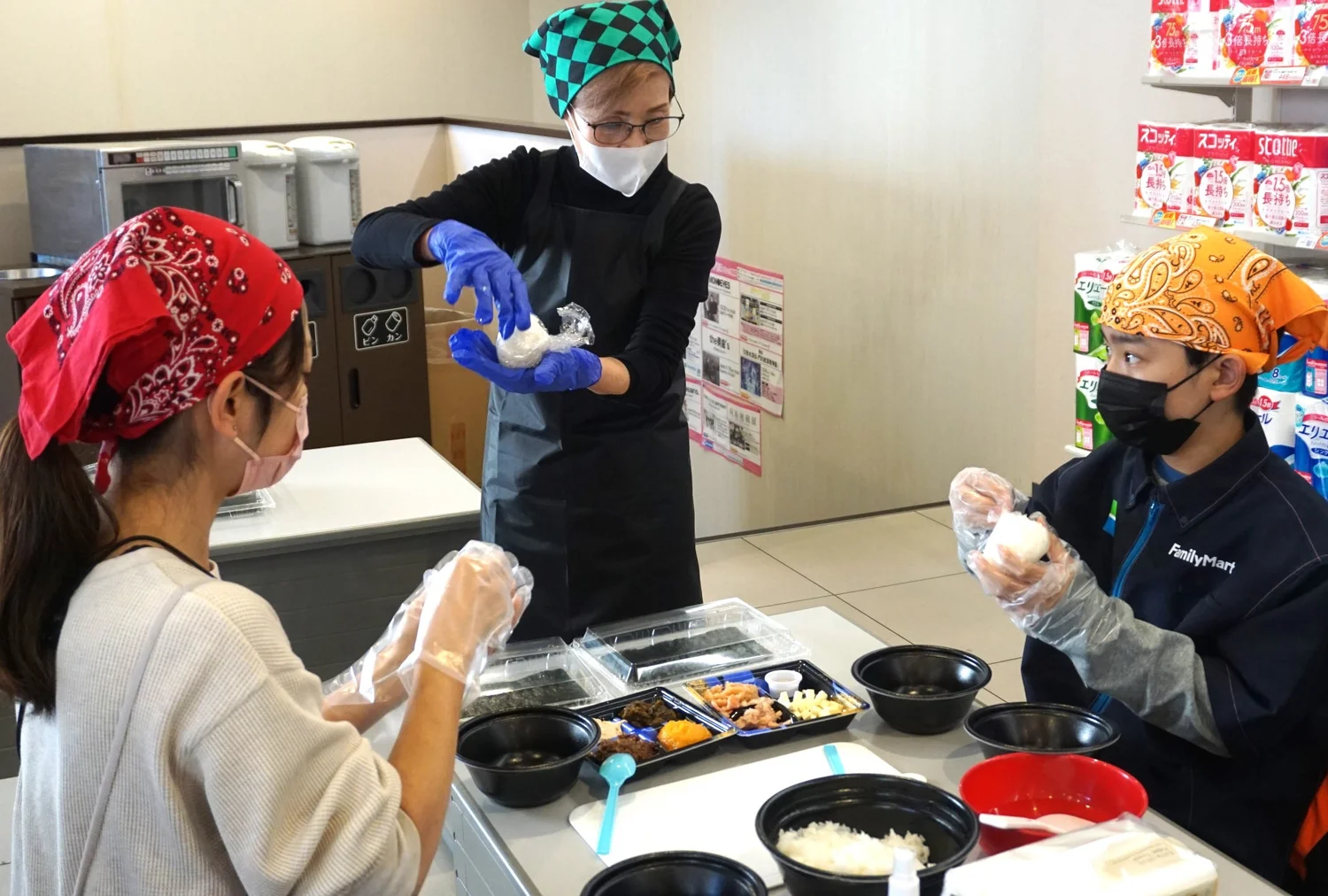 Children happily making fluffy rice balls with various ingredients.
